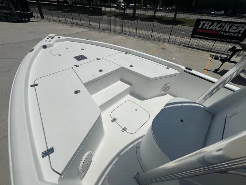 Slide: The Image of 2010 Sea Hunt 21 XP boat deck with storage compartments and seating. - 10