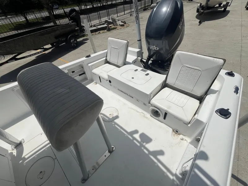 Slide: The Image of 2010 Sea Hunt 21 XP boat interior with seating and outboard motor. - 12