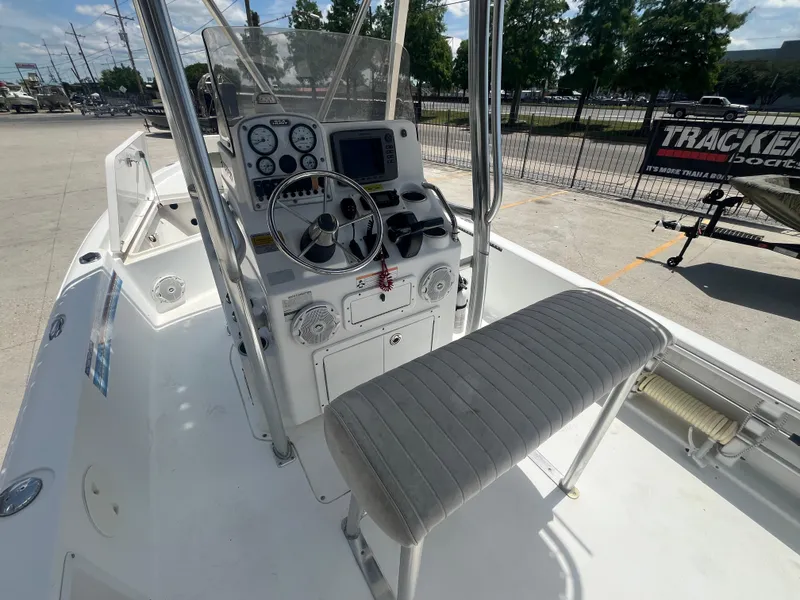 Slide: The Image of 2010 Sea Hunt 21 XP boat cockpit with steering wheel and control panel. - 13
