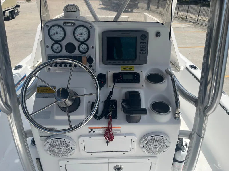 Slide: The Image of Control panel of a 2010 Sea Hunt 21 XP boat with steering wheel and gauges. - 14