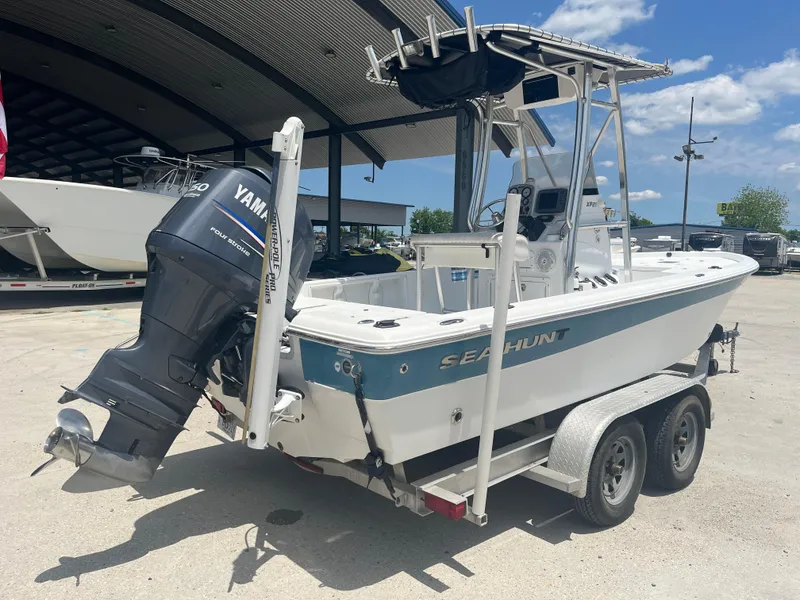 Slide: The Image of 2010 Sea Hunt 21 XP boat with Yamaha outboard motor on a trailer. - 7