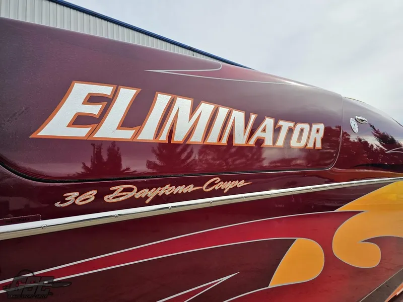 Slide: The Image of 2008 Eliminator 36 Daytona Coupe boat with bold graphics and sleek design. - 16