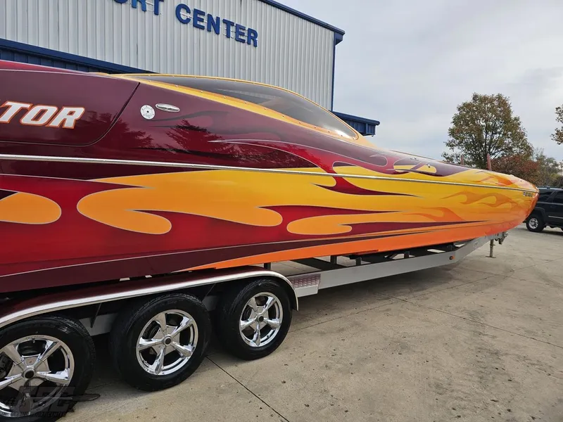 Slide: The Image of 2008 Eliminator 36 Daytona Coupe with vibrant flame design on trailer. - 22