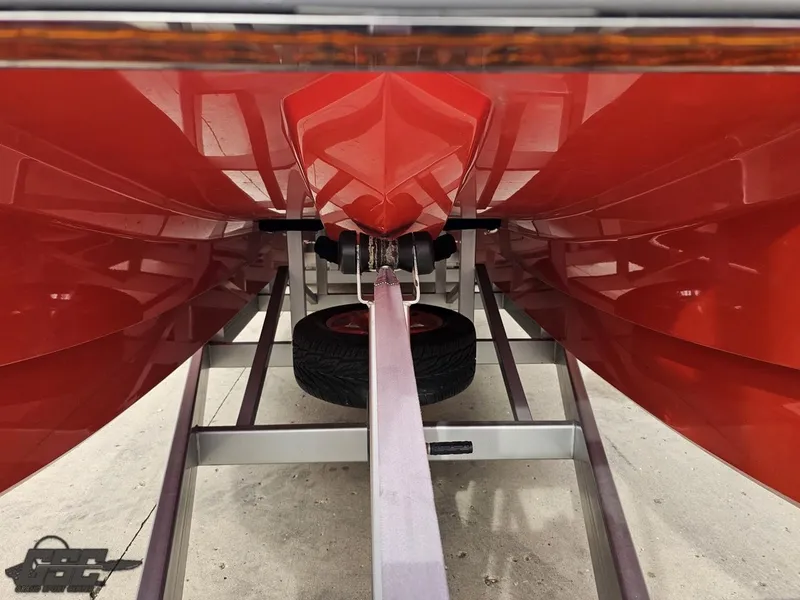 Slide: The Image of Underneath view of a 2008 Eliminator 36 Daytona Coupe boat on a trailer. - 33