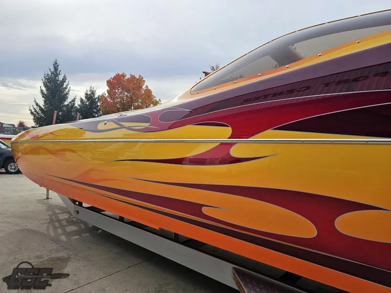 Slide: The Image of 2008 Eliminator 36 Daytona Coupe with vibrant flame design on trailer. - 38