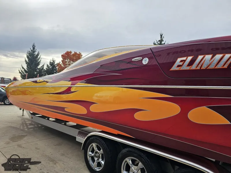 Slide: The Image of 2008 Eliminator 36 Daytona Coupe with vibrant flame design on trailer. - 39
