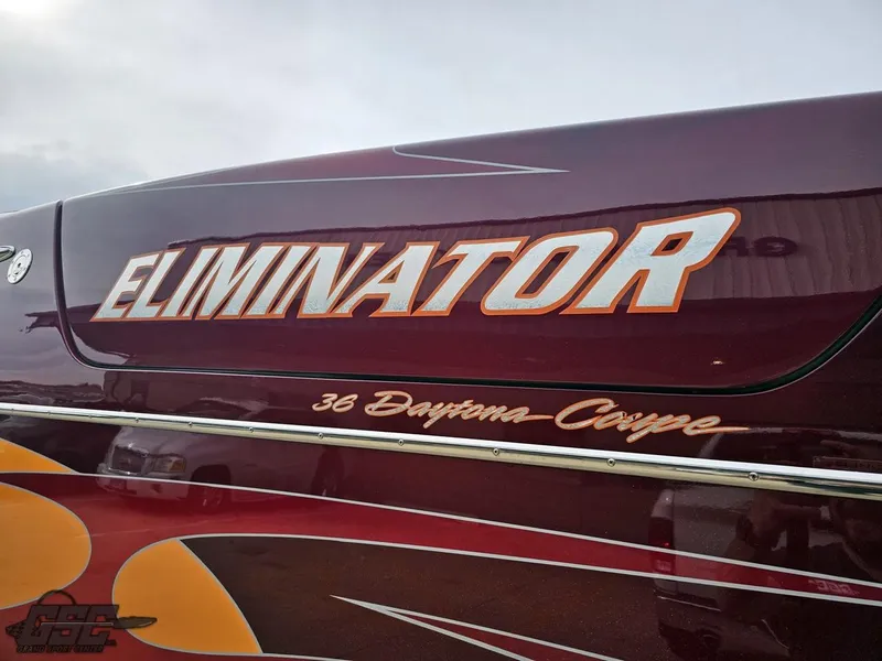 Slide: The Image of 2008 Eliminator 36 Daytona Coupe boat with bold lettering and sleek design. - 41