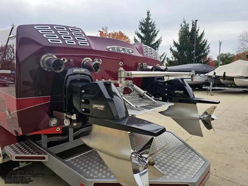 Slide: The Image of 2008 Eliminator 36 Daytona Coupe boat with dual propellers and sleek maroon finish. - 44