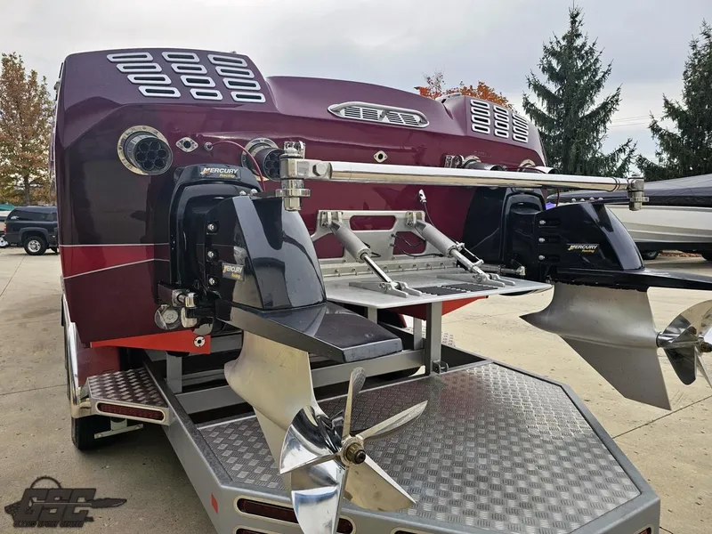 Slide: The Image of 2008 Eliminator 36 Daytona Coupe boat with dual propellers on a trailer. - 45