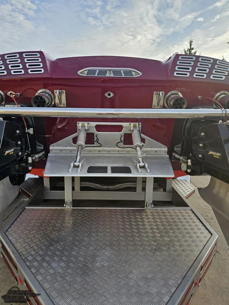 Slide: The Image of 2008 Eliminator 36 Daytona Coupe boat rear view with dual engines and metallic platform. - 47