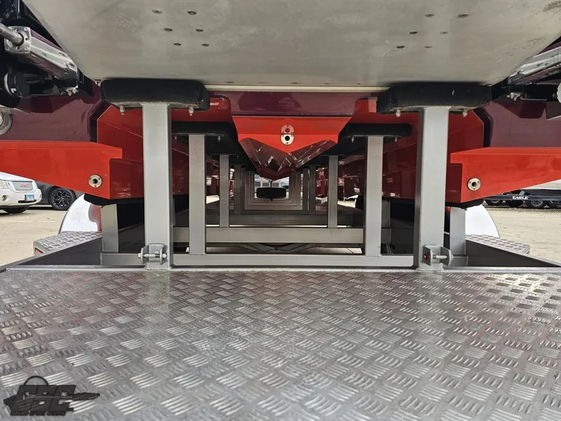 Slide: The Image of Underneath view of a 2008 Eliminator 36 Daytona Coupe on a metal platform. - 48