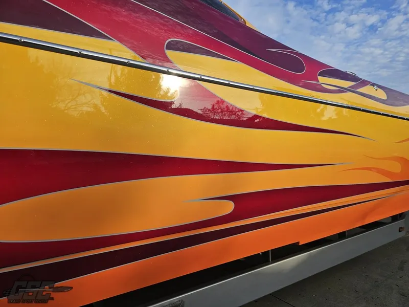Slide: The Image of 2008 Eliminator 36 Daytona Coupe with vibrant flame graphics on the side. - 9