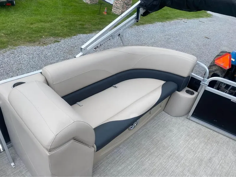 Slide: The Image of Avalon GS2185 2017 boat interior with beige and black seating on a pontoon deck. - 7