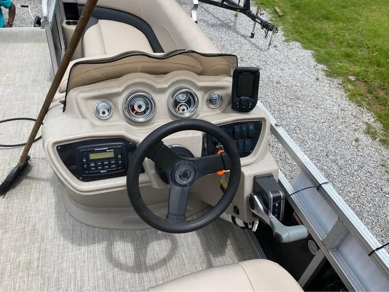 Slide: The Image of Steering console of a 2017 Avalon GS2185 boat with gauges and controls. - 9