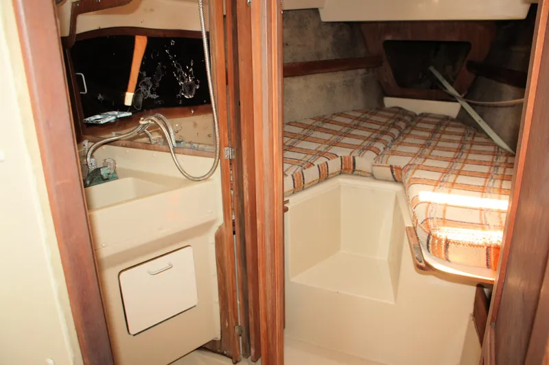 Slide: The Image of Interior of 1981 O'Day 34 sailboat with sink and cozy sleeping area. - 20