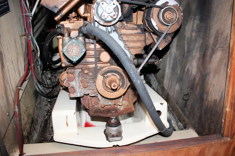 Slide: The Image of 1981 O'Day 34 engine compartment with visible mechanical components and wiring. - 26