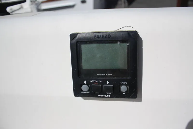 Slide: The Image of Simrad autopilot control on 1981 O'Day 34 sailboat dashboard. - 30