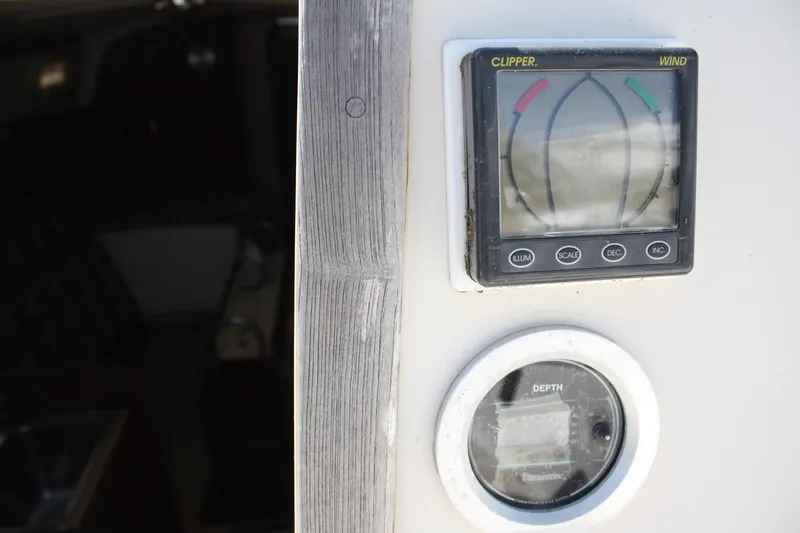 Slide: The Image of O'Day 34 sailboat instruments, 1981 model, featuring wind and depth gauges. - 31