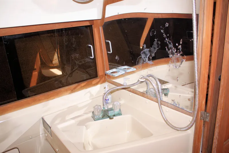Slide: The Image of Interior of 1981 O'Day 34 sailboat bathroom with sink and mirror. - 36