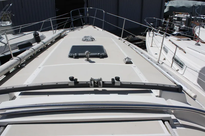 Slide: The Image of 1981 O'Day 34 sailboat deck view, showcasing clean lines and railing details. - 8