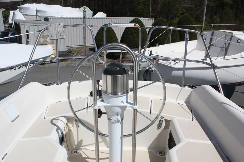 Slide: The Image of 1981 O'Day 34 sailboat cockpit with steering wheel and navigation equipment. - 9