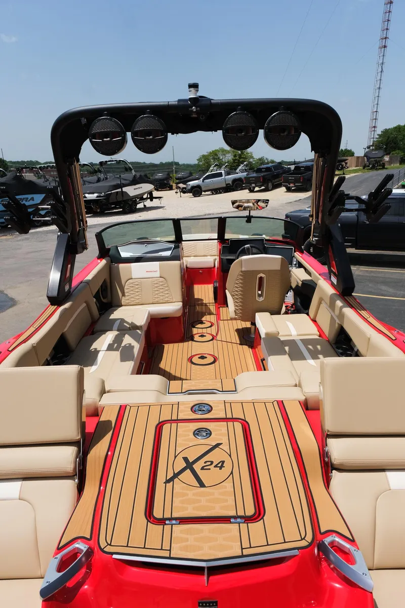 Slide: The Image of 2025 MasterCraft X24 boat interior with luxurious seating and advanced sound system. - 18