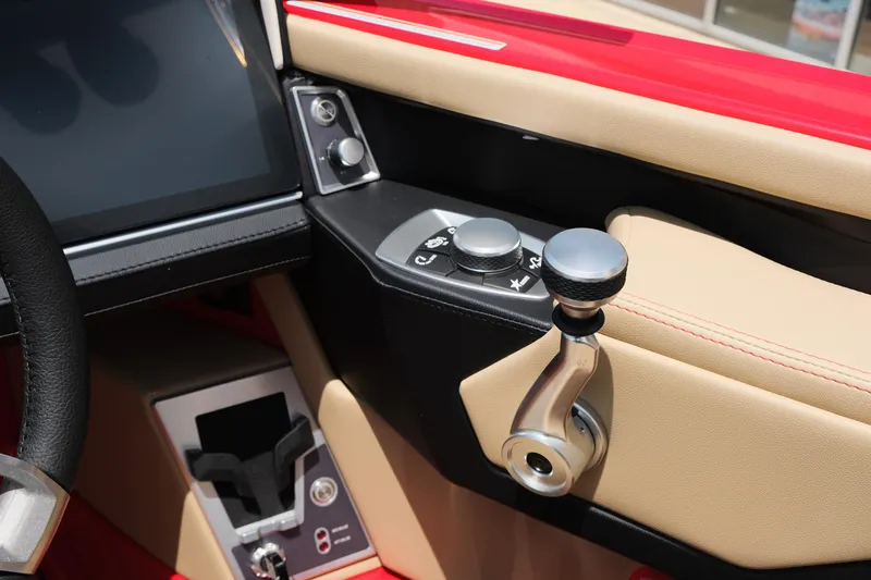 Slide: The Image of 2025 MasterCraft X24 boat interior with control panel and joystick. - 31