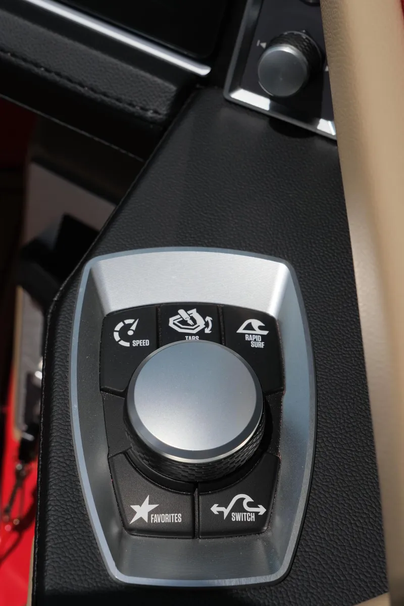 Slide: The Image of Control panel of 2025 MasterCraft X24 boat with multifunctional buttons and dial. - 33
