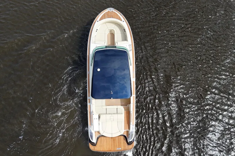 Slide: The Image of 2020 Chris-Craft Launch 31 GT boat on water, aerial view. - 101
