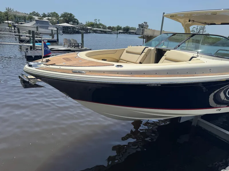 Slide: The Image of 2020 Chris-Craft Launch 31 GT cruising on open water, showcasing luxury design and performance. - 12