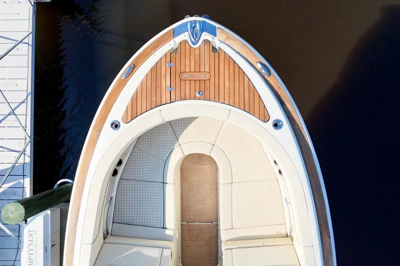 Slide: The Image of 2020 Chris-Craft Launch 31 GT speeding on a scenic lake with waterfront homes. - 14