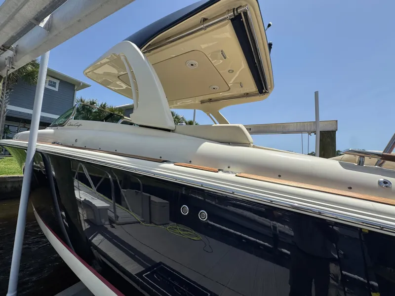 Slide: The Image of Overhead view of 2020 Chris-Craft Launch 31 GT cruising on water. - 24