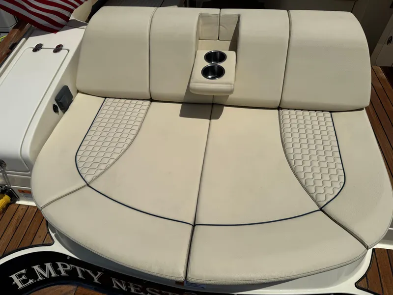 Slide: The Image of 2020 Chris-Craft Launch 31 GT boat with luxurious beige seating and wood accents. - 38