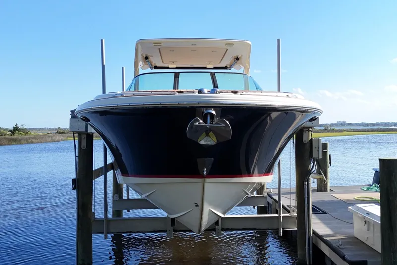 Slide: The Image of 2020 Chris-Craft Launch 31 GT cruising on open water, showcasing luxury design and performance. - 5