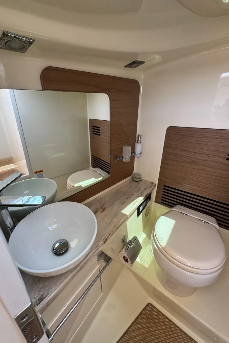 Slide: The Image of 2020 Chris-Craft Launch 31 GT interior with luxurious cream seating and elegant wood accents. - 68