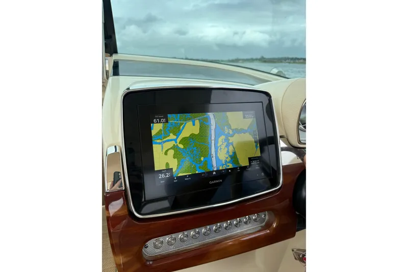 Slide: The Image of 2020 Chris-Craft Launch 31 GT dashboard with Garmin navigation display. - 79