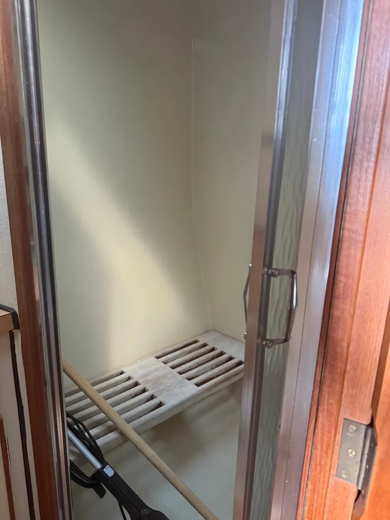 Slide: The Image of 1985 Trojan F36 shower area with wooden slats and glass door. - 14