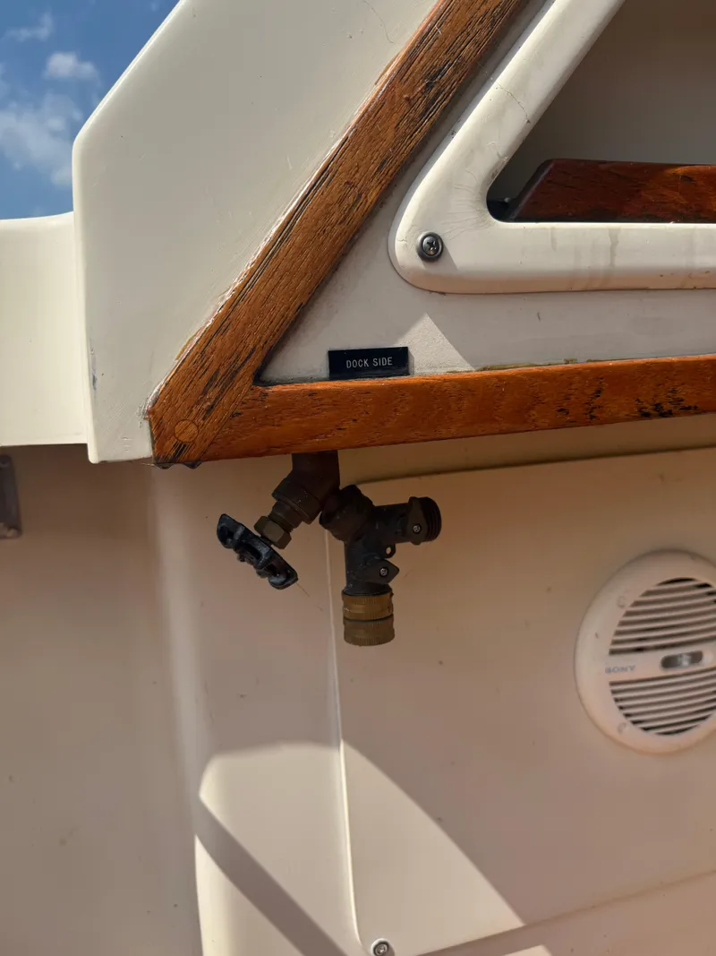 Slide: The Image of 1985 Trojan F36 boat detail showing exterior fittings and wood trim. - 21