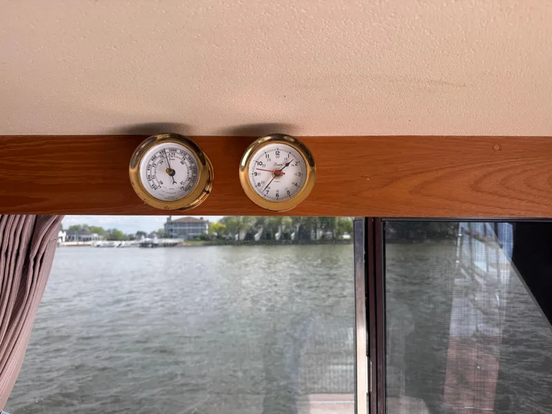 Slide: The Image of Interior of 1985 Trojan F36 boat with gauges and water view. - 22