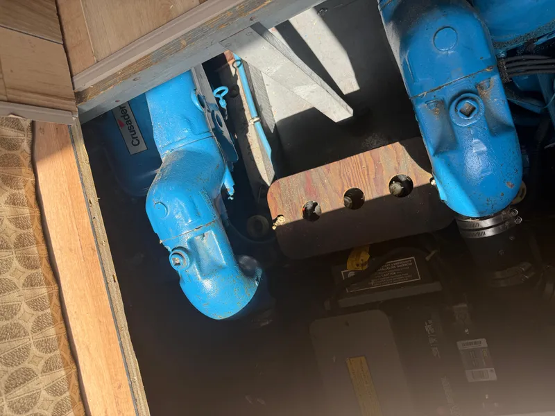 Slide: The Image of Engine compartment of a 1985 Trojan F36 boat with blue components. - 25