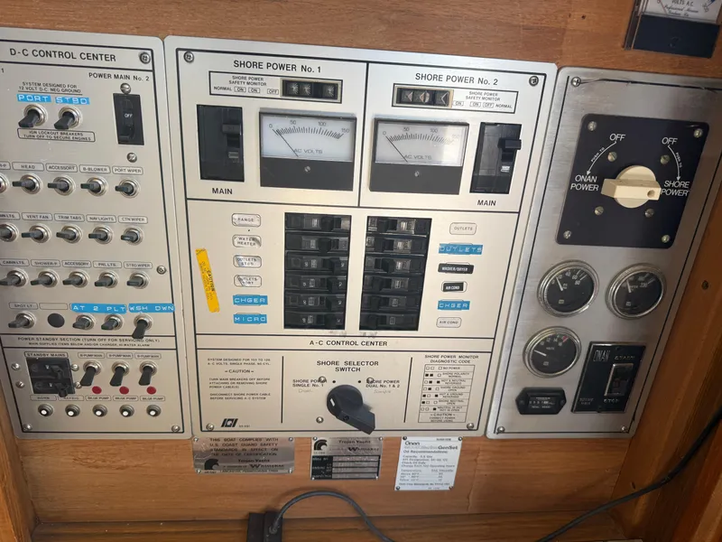 Slide: The Image of Electrical control panel of a 1985 Trojan F36 boat, featuring various switches and gauges. - 5