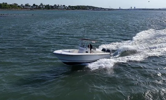 Slide: The Image of 2005 Pursuit 2570 Center Console boat cruising on open water. - 13
