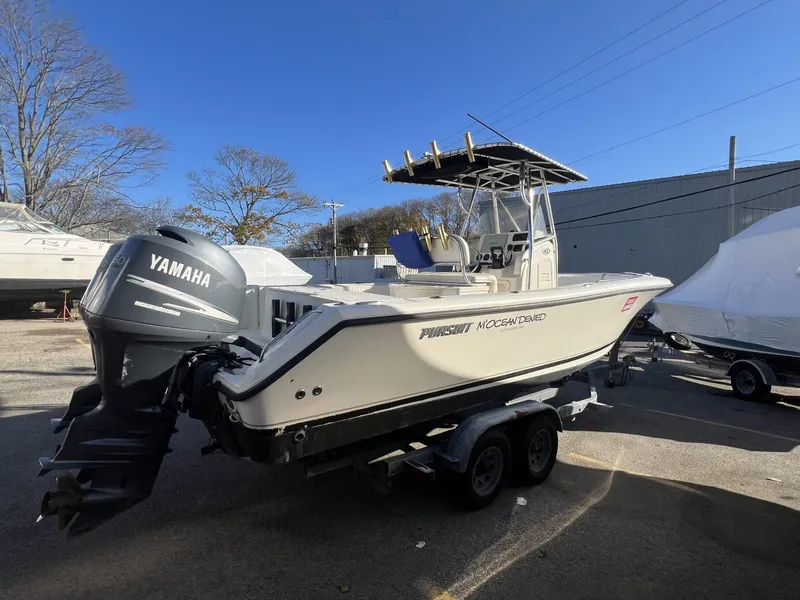 Slide: The Image of 2005 Pursuit 2570 Center Console boat with Yamaha engine on trailer. - 26