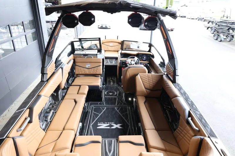 Slide: The Image of 2025 Tigé Ultré 25ZX boat interior with luxurious seating and modern design. - 14