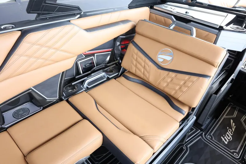 Slide: The Image of 2025 Tigé Ultré 25ZX boat interior with luxurious tan leather seating and modern design. - 17