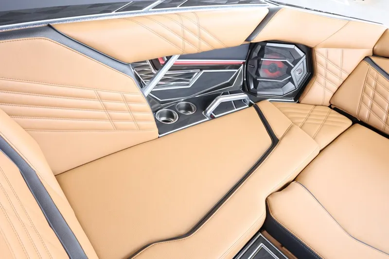 Slide: The Image of 2025 Tigé Ultré 25ZX interior with tan leather seats and modern design elements. - 20