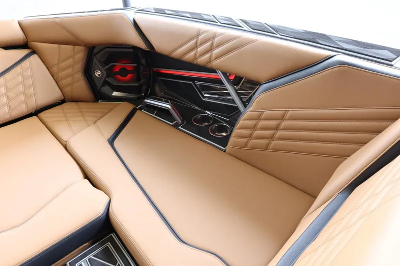 Slide: The Image of Luxurious interior of 2025 Tigé Ultré 25ZX boat with tan leather seating. - 21