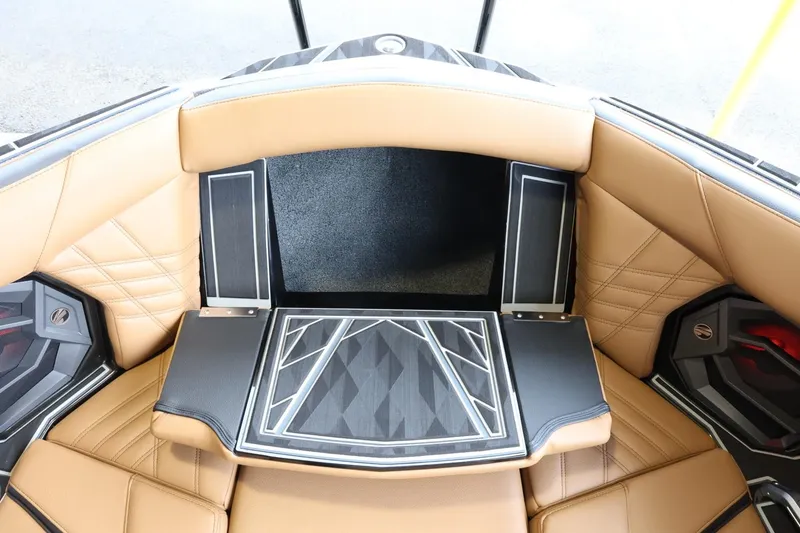 Slide: The Image of 2025 Tigé Ultré 25ZX boat interior with tan leather seating and modern design. - 23