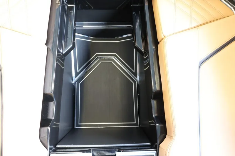 Slide: The Image of Interior storage compartment of 2025 Tigé Ultré 25ZX boat, featuring sleek design and premium materials. - 24