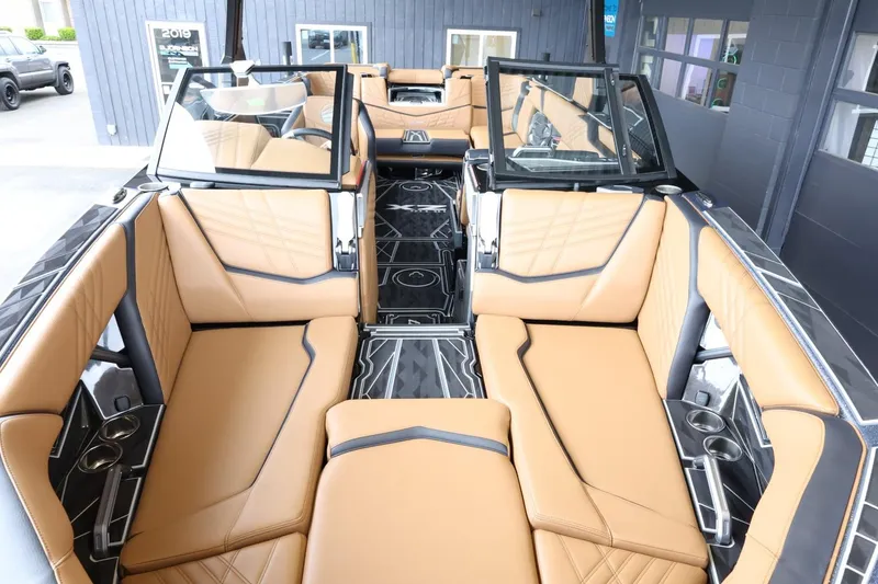 Slide: The Image of Luxurious interior of 2025 Tigé Ultré 25ZX boat with tan leather seating. - 26